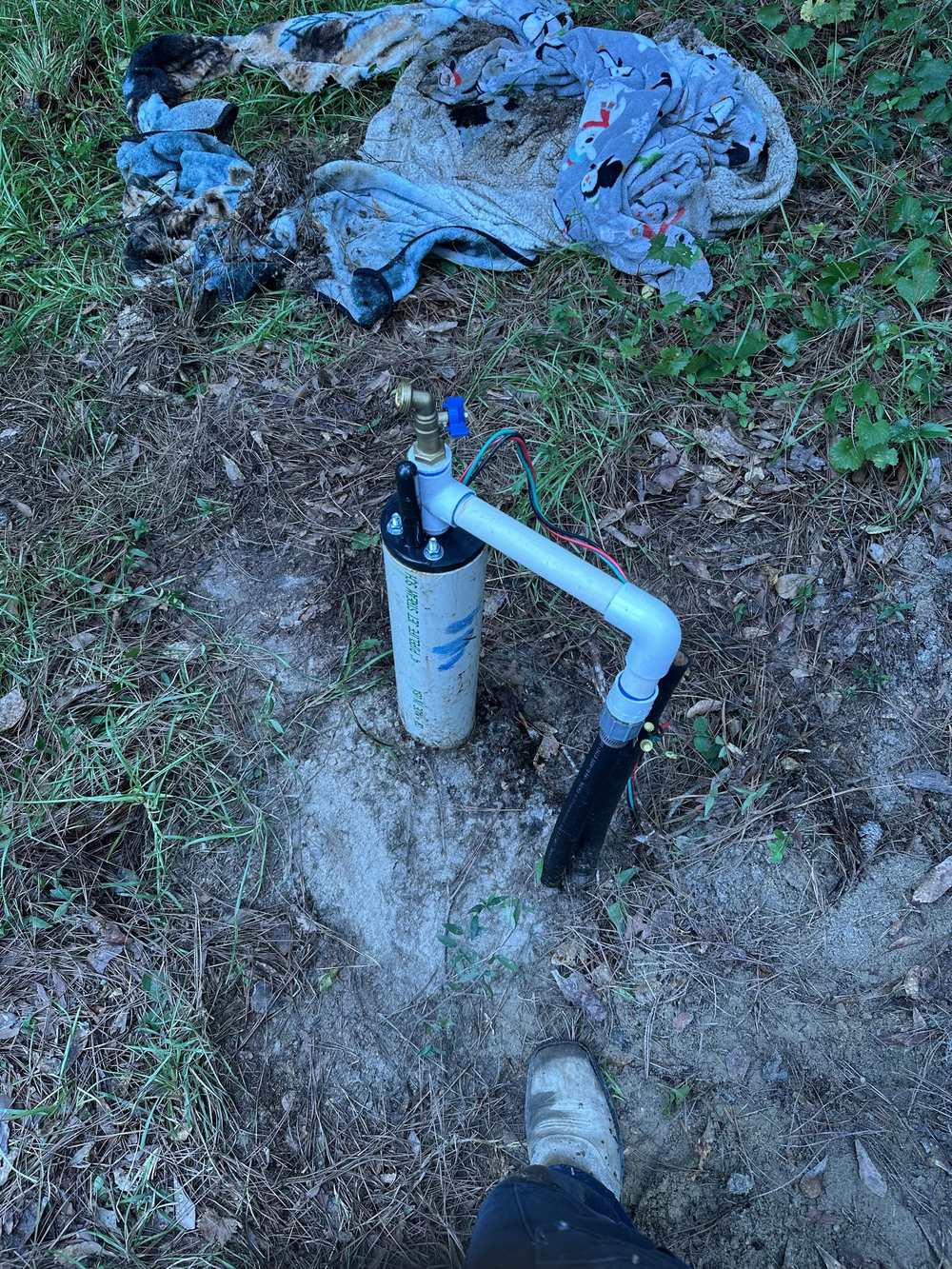 Finished wellhead with pump wiring and discharge line