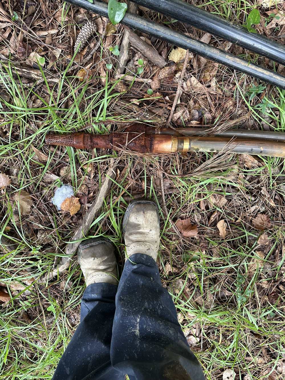 Corroded well screen and drill pipe recovered from a well