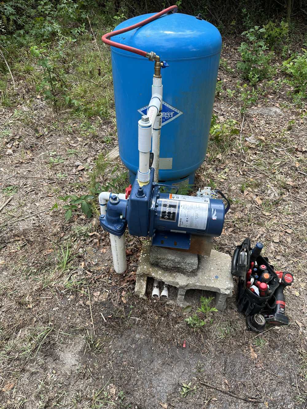Above-ground jet pump and pressure tank installed by H&H Water Well Service